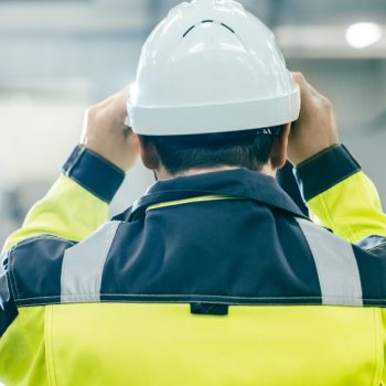 Back,View,Shot,Of,The,Industrial,Engineer,Wearing,Protective,Clothing