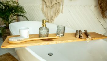 stylish-bathroom-interior-boho-style-bathroom-has-shelf-brushes-soap-body-oils_352502-613