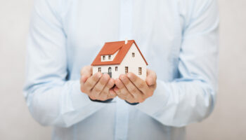 Small,Toy,House,In,Hands