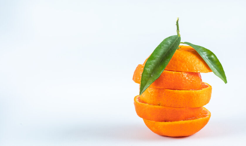 sliced orange isolated on white background